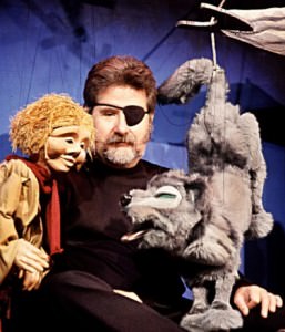 Christopher Piper (Center) and Peter and the Wolf. Photo courtesy of The Puppet Co.