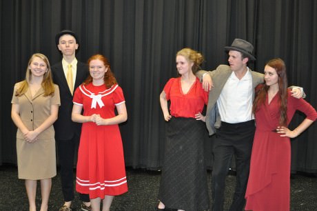 L to R: Grace Farrell (Nicole Sheehan), Daddy Warbucks (Jack Posey), Annie (Nancy Pruett), Mrs. Hannigan (Rachel Lawhead), Rooster (Thomas Kelty), and Lily St. Regis (Abby Huston).. Photo by Karen Perry.