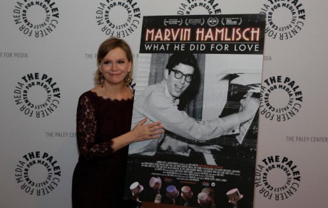Terre Blair Hamlisch with poster of her husband, composer Marvin Hamlisch (1944–2012).