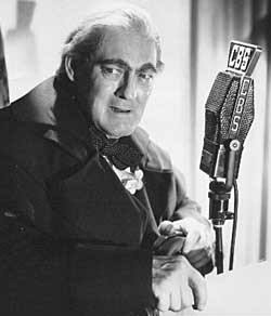 Lionel Barrymore performing  the role of Scrooge on the radio.