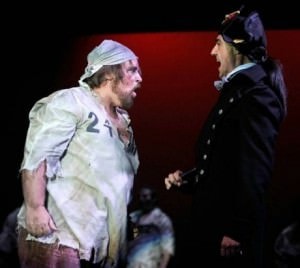 David Michael Felty (Jean Valjean) and Thomas Adrian Simpson (Javert). Photo courtesy of Riverside Center Dinner Theater.