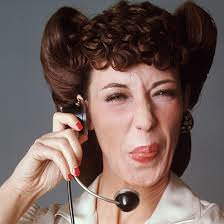 Lily Tomlin as Ernestine the Operator. 