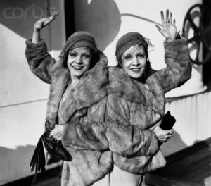 Famous Siamese twins, Violet, left, and daisy Hilton of Texas, pictured aboard the S.S. Aquitania upon return from a theatrical performance in England. --- Image by © Bettmann/CORBIS.