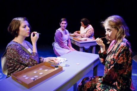  Foreground (l-r): Charlotte (Krissy McGregor) shows Catherine (Sarah Wade) the technique for painting watch faces Background (l-r): Frances (Josette Dubois) and Pearl (Aricia Skidmore-Williams) are curious about their new co-worker. Photo courtesy of Colbourn Images.